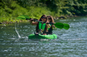 Inflatable kayak for two persons and a small dog.